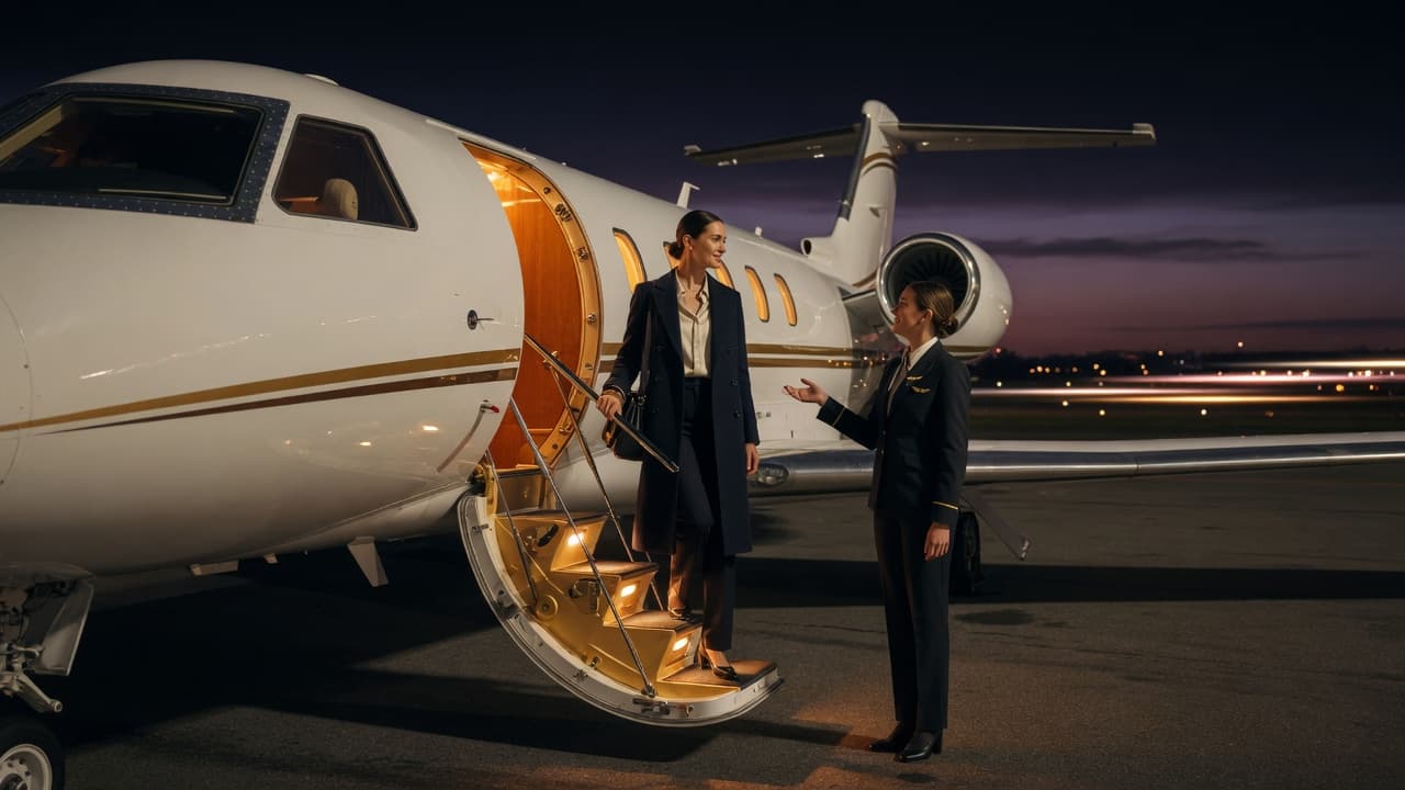 Guest stepping from a long-range private aircraft at night